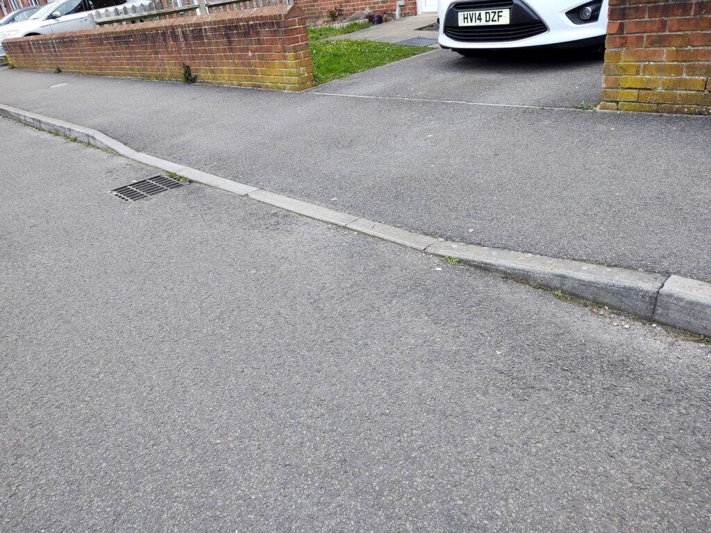A standard dropped kerb or vehicle crossing in the UK